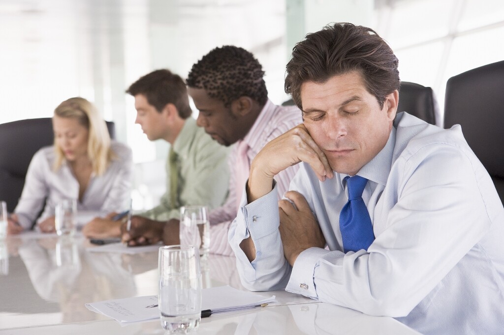 Man sleeping in work meeting