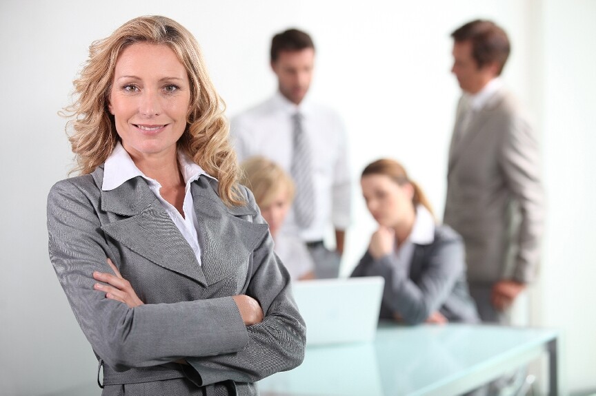 Business woman standing with arms crossed