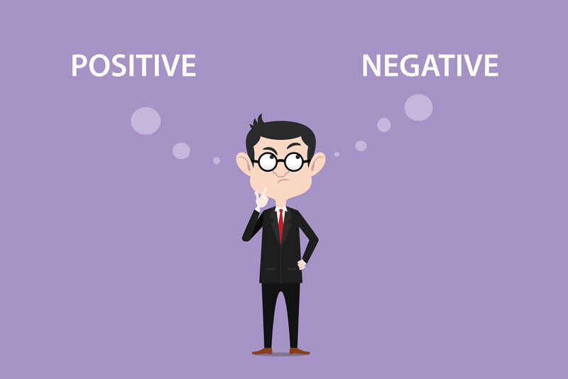 Cartoon Man Comparing Positive and Negative