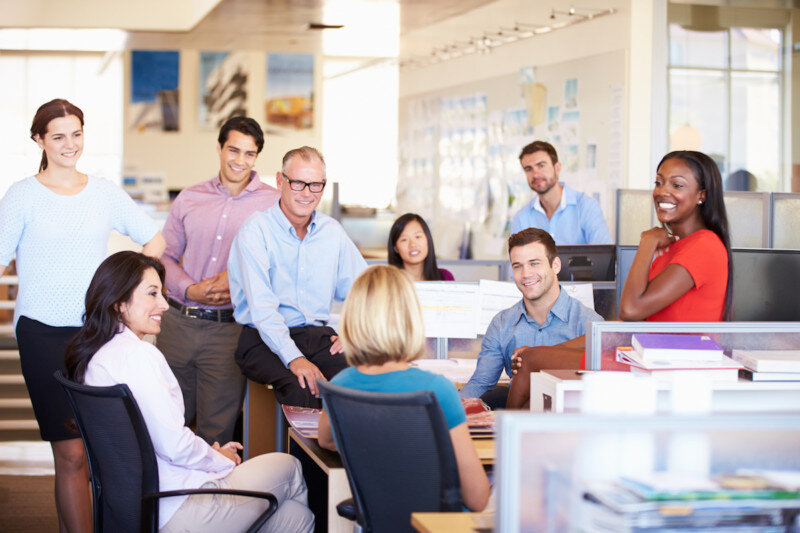 Businesspeople Having Meeting In Modern Open Plan Office