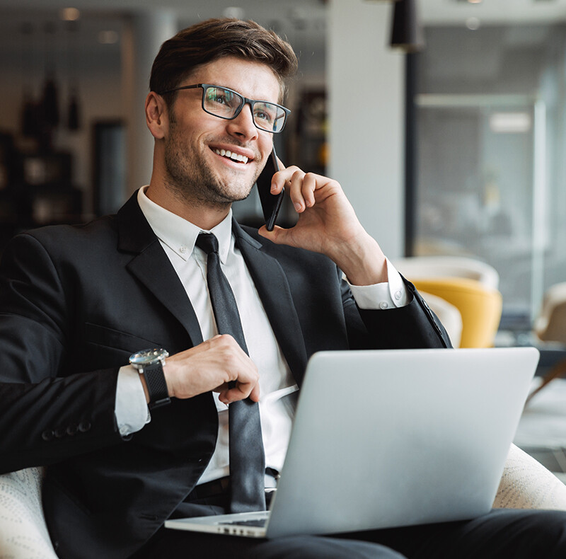 Man in Suit Talking on Cell Phone